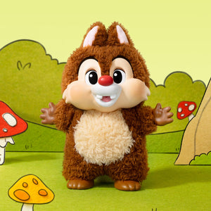 Cute brown plush toy figure with big eyes and a smile, featuring fluffy texture, in a colorful forest setting.