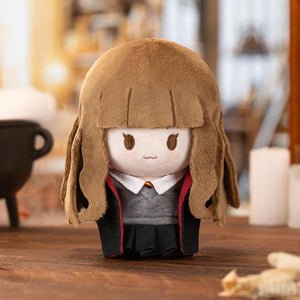 Harry Potter Magic Academy Cotton Doll of Hermione Granger with distinctive Gryffindor uniform and brown hair. Officially licensed collectible with accurate character details.