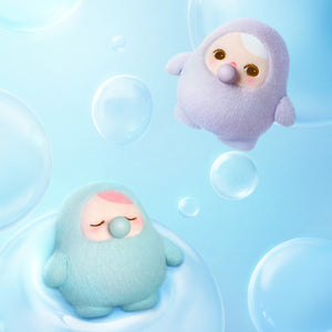 PUCKY BEANIE BUBBLE UP SERIES light blue plush pendant featuring cute round character with beanie hat on blue background. Collectible blind box toy with keychain attachment.