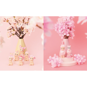 SONNY ANGEL Cherry Blossom Series: Hanami Edition figures surrounded by pink flowers in a pastel setting.